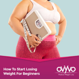 Overweight woman with scale and tape-measure ready to learn How To Start Losing Weight For Beginners